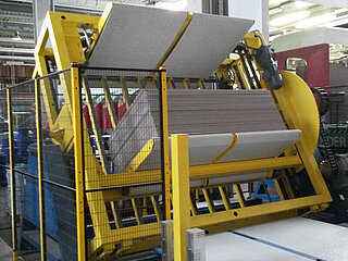 Stack turner Stack turner with stack of corrugated board