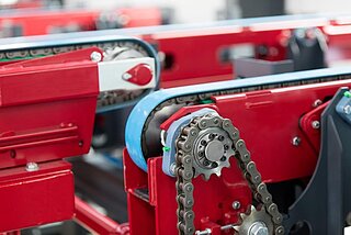 Detail view of a chain conveyor with care belts Detail view of a chain conveyor with care belts