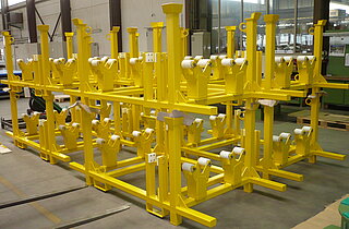 Stackable transport rack for whellset axles Stackable transport rack for whellset axles: This transport rack are used to tranport and store each two drive wheelset axles with assembled large gear wheels. The picture shows 8 frames, always 2 stacked on top of each other.